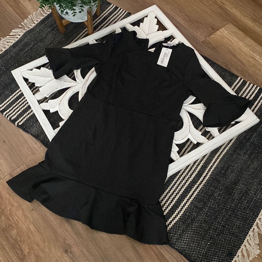 Brand new with tags little black dress from Meaneor. Size large.